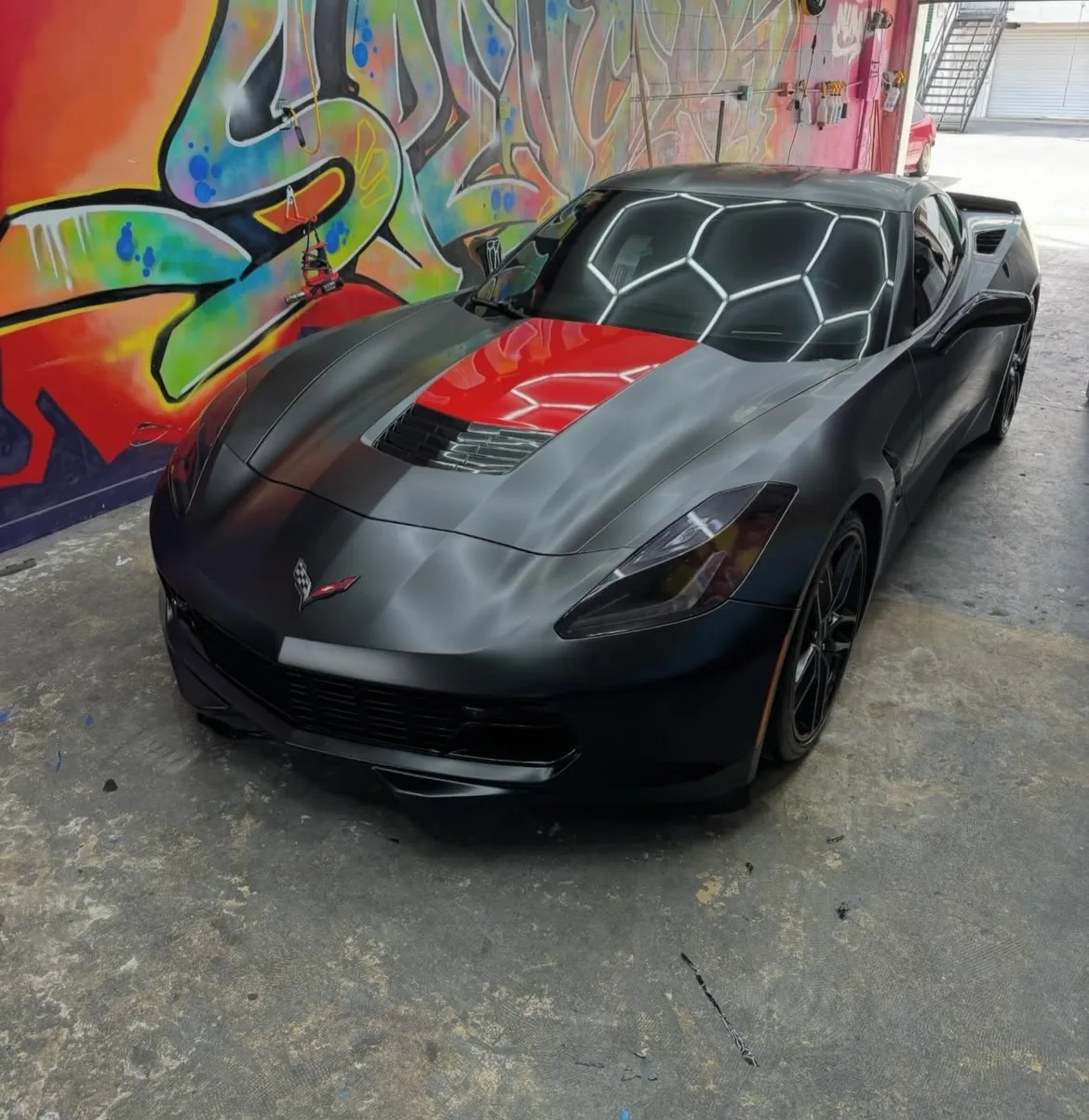 Matte black Corvette, red accents